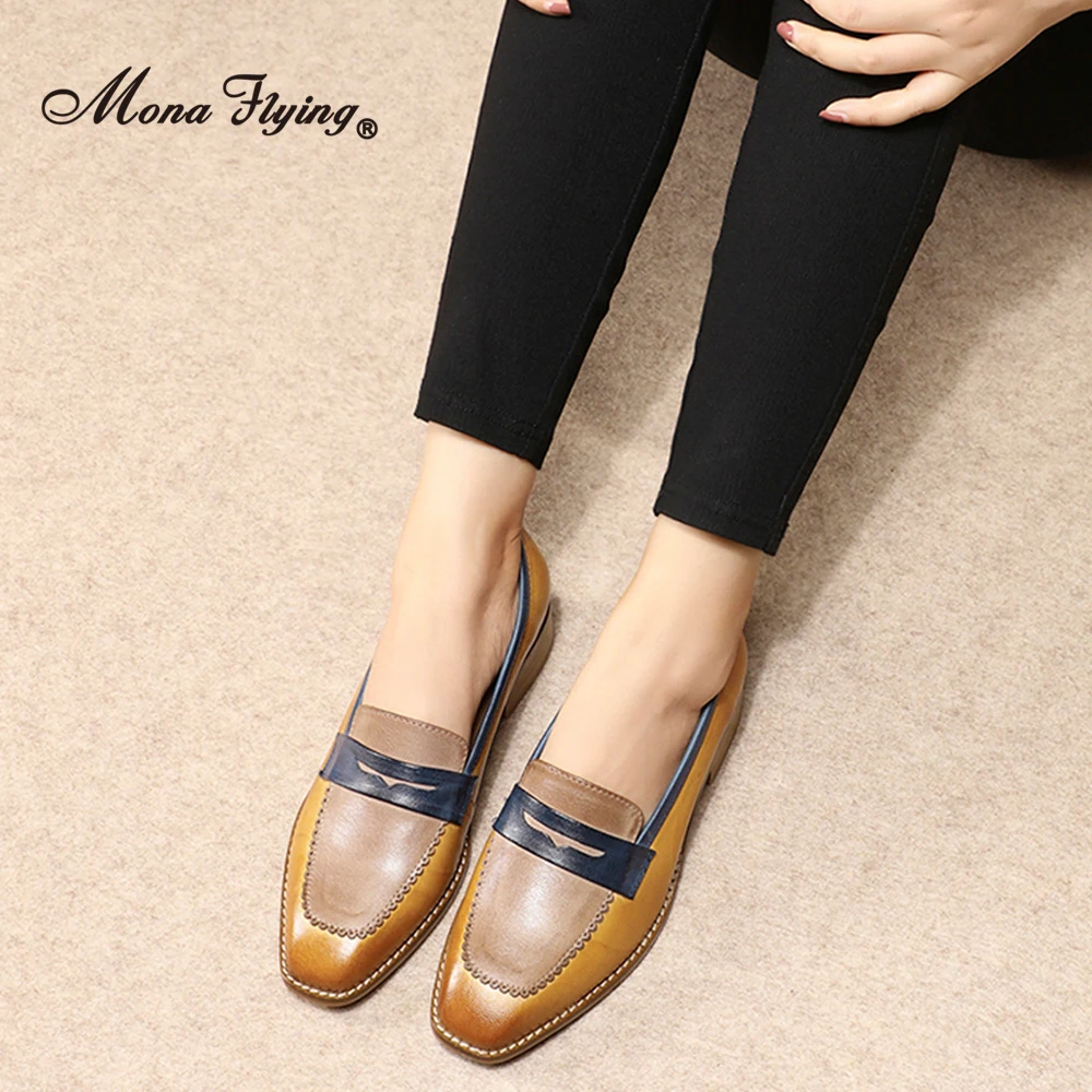 Classic leather square toe penny loafers showcasing timeless geometric design