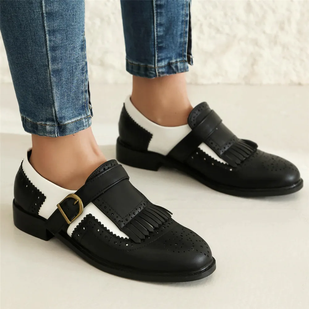 Styling leather tassel loafers casually with a variety of tops