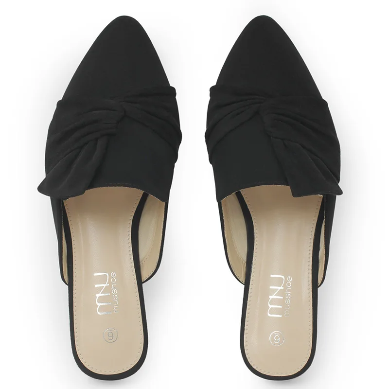 Classic pointed-toe flat loafers perfectly styled with cropped jeans to showcase the footwear