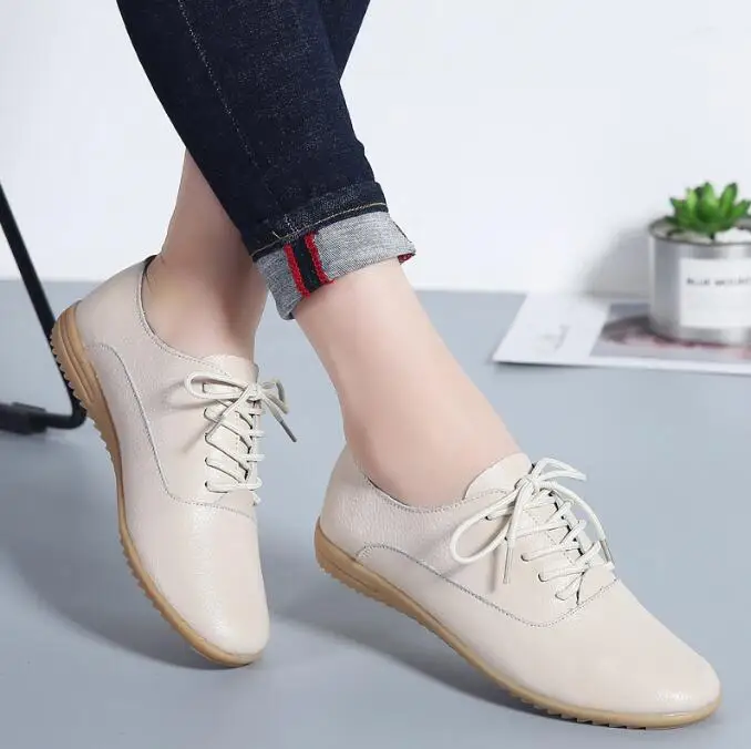 Pointed toe leather loafers styled with straight-leg jeans for a sophisticated everyday outfit