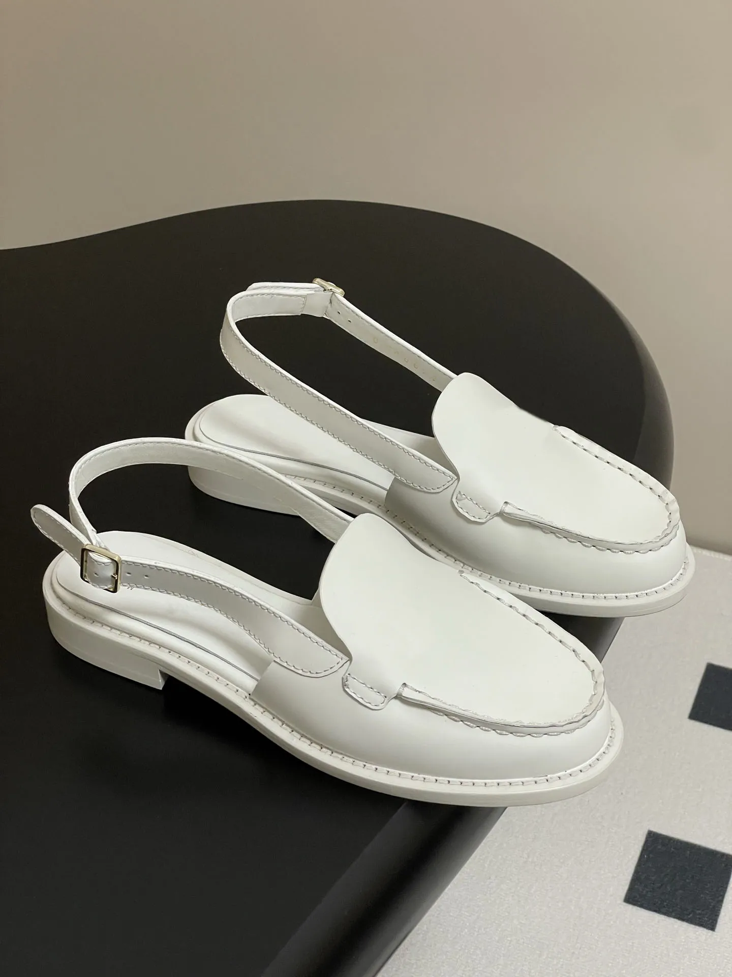 Slingback black loafers requiring proper care for longevity