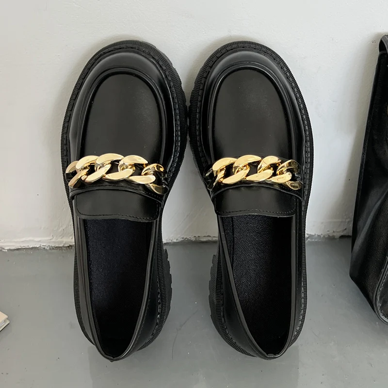 Black platform loafers showing quality leather needing proper maintenance