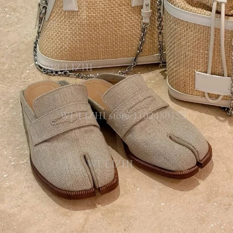 Open-back leather loafer mules showing the modern heel-free design