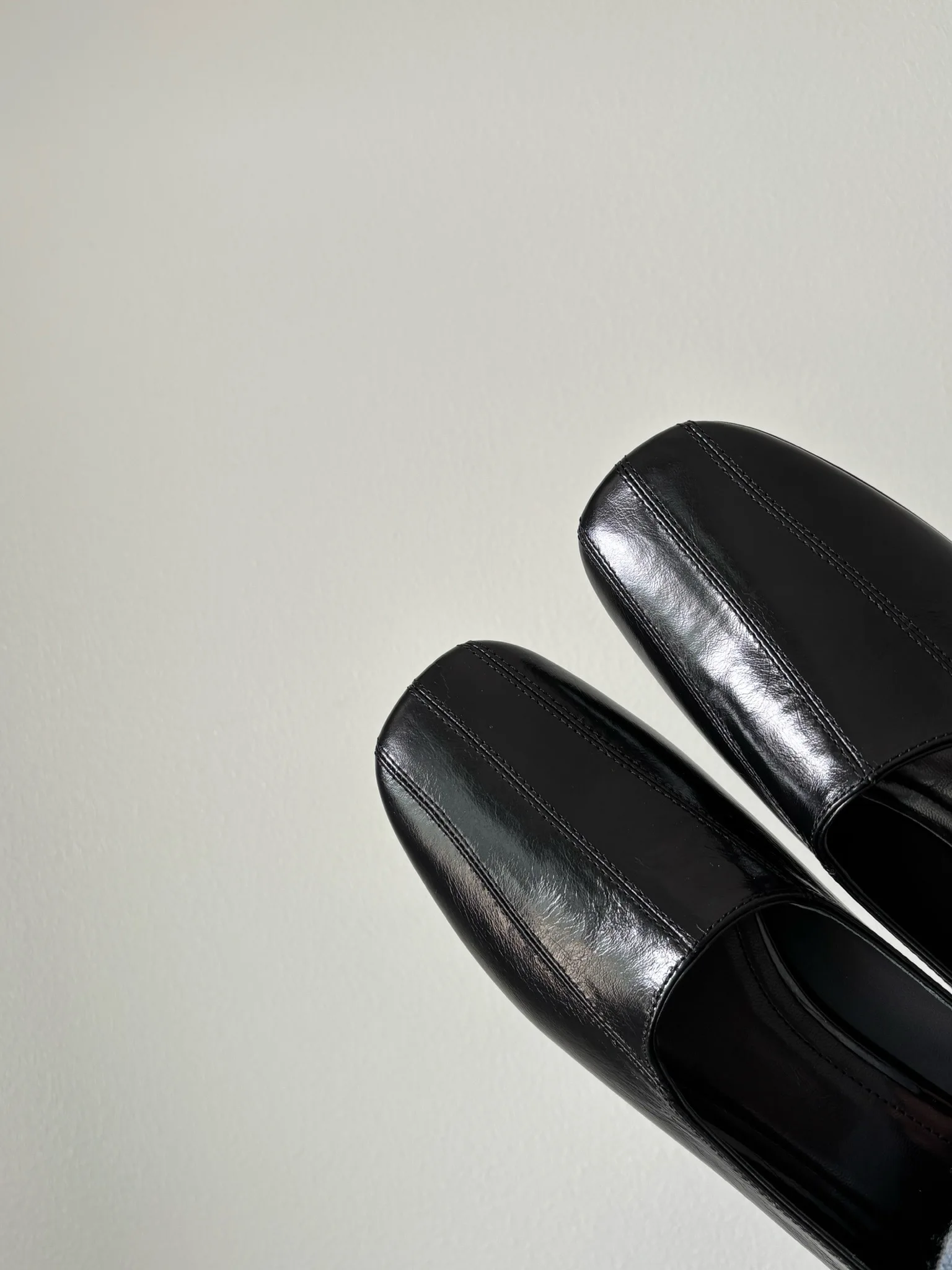 Classic leather mid heel loafers featuring comfortable round toe design for professional settings