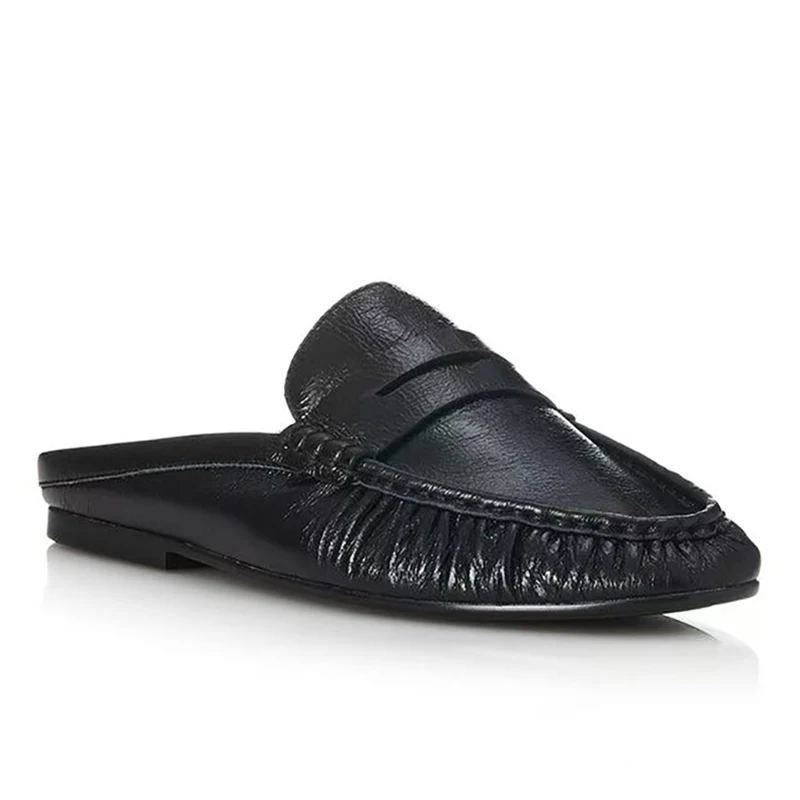 Loafer mules styled with perfectly hemmed denim showing the ideal crop length