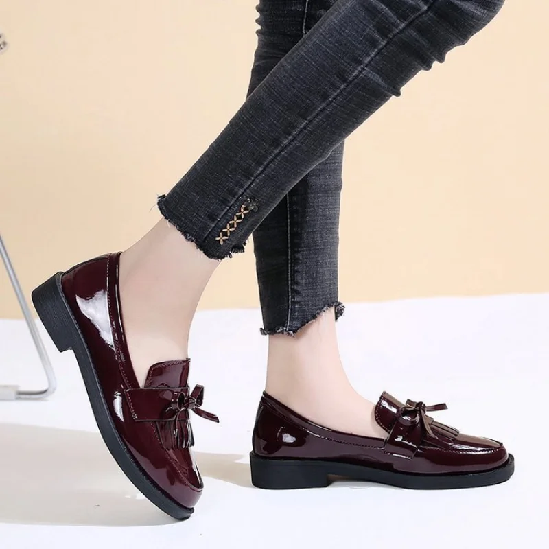 Platform loafers creating balanced proportions with wide-leg jeans