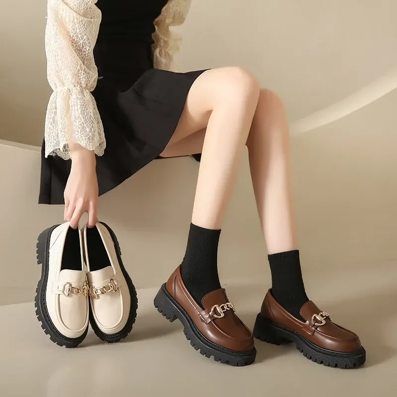 Platform loafers with chain detail showing dramatic style impact