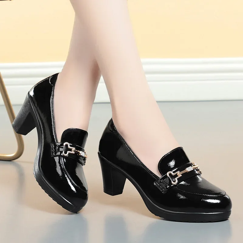 Business casual outfit featuring block heel loafers with tailored pants and blazer