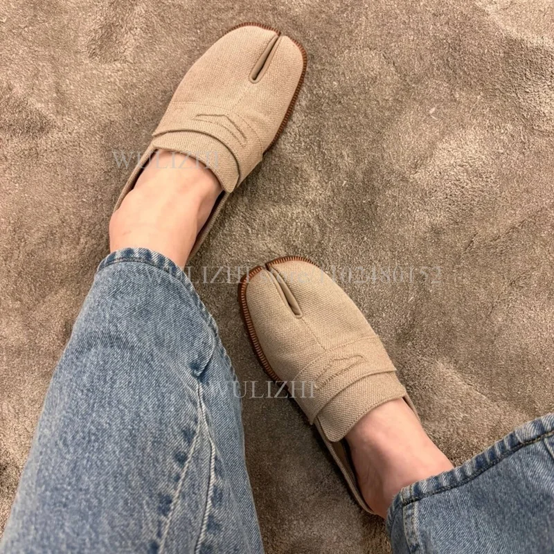 Canvas split toe loafer mules offering casual slip-on convenience