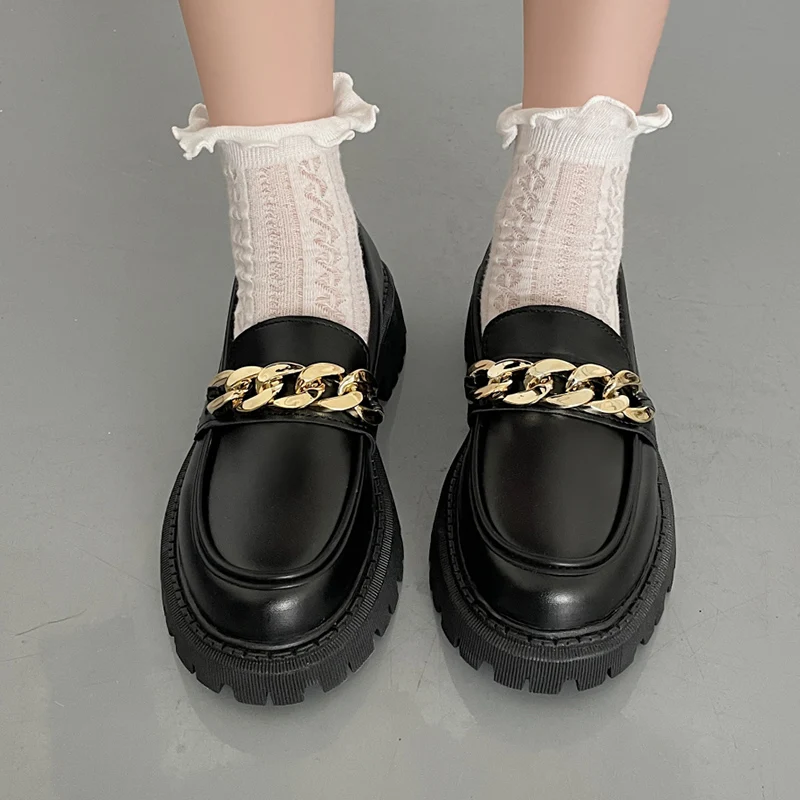 Elegant black loafers with vintage chain detail for elevated wardrobes